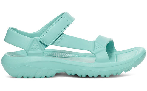 Side view of a light blue sandal with thick adjustable straps and a chunky treaded sole.