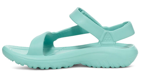 Side view of mint green rubber sandal with toe and ankle straps and a ridged sole.