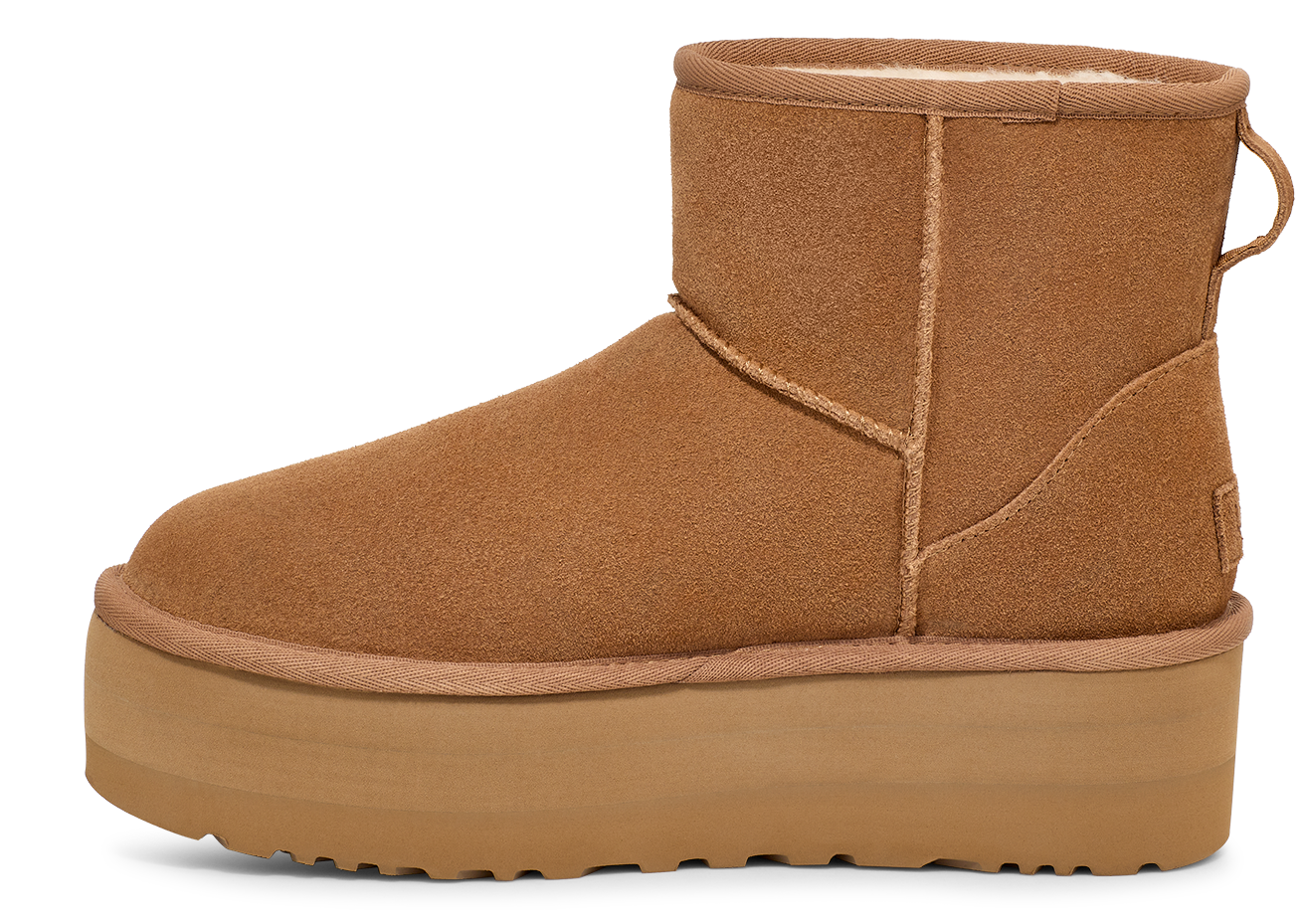 Side-view of a tan short boot with a thick platform sole.