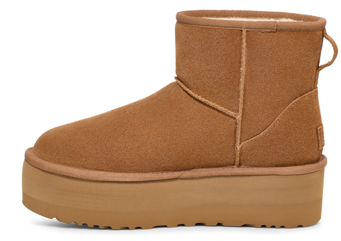 Side-view of a tan short boot with a thick platform sole.