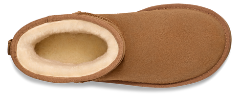 Close-up of a brown, slipper-style shoe with a visible white, fuzzy interior.