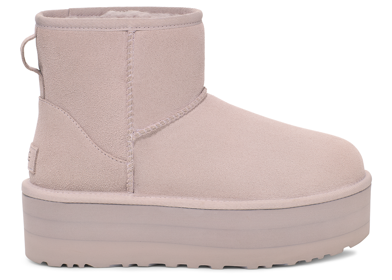 Platform mini boot in pale lavender color, featuring a suede upper and pull tab.