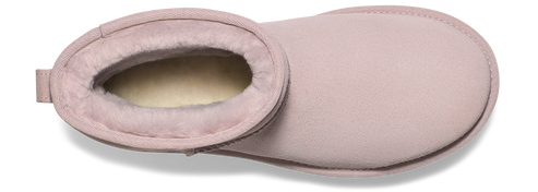 Light pink UGG Tasman slipper with cream-colored shearling lining visible from the top.