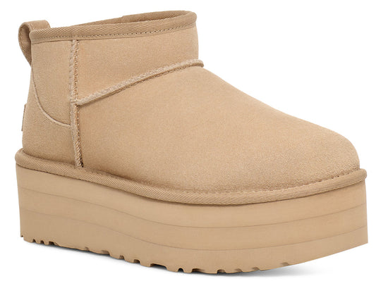 Tan platform bootie with a rounded toe and a stacked platform sole.