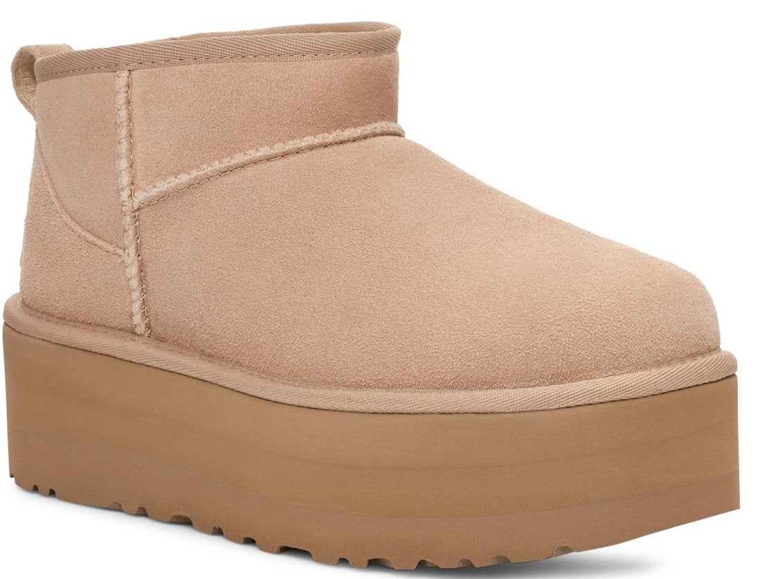A short tan platform boot with a rounded toe.