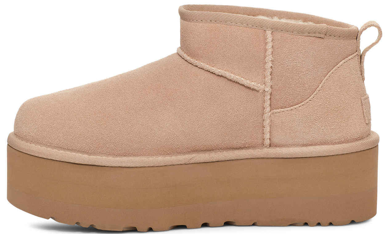Tan suede platform mini boot with a rounded toe.