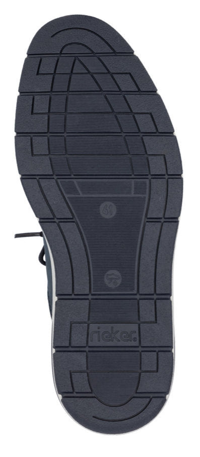 Close-up of a dark shoe sole with a textured tread pattern and 'Rieker' branding.