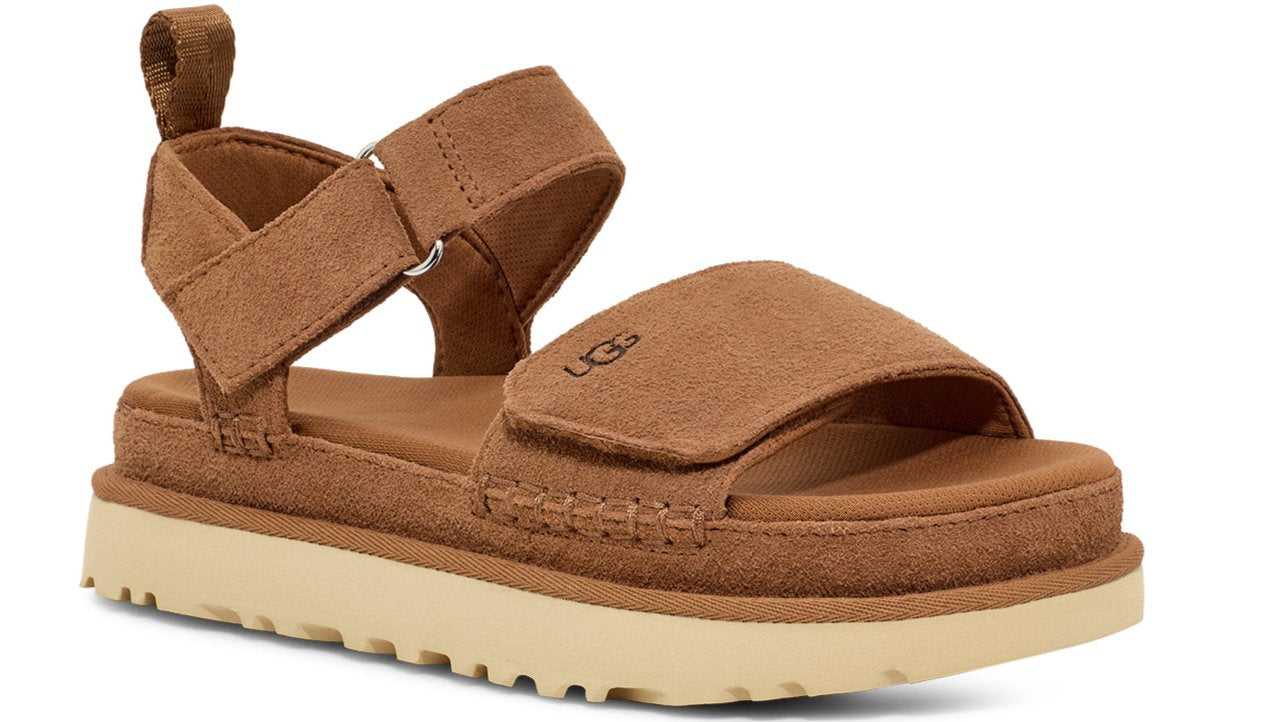 Tan suede sandal with thick platform sole and adjustable straps.