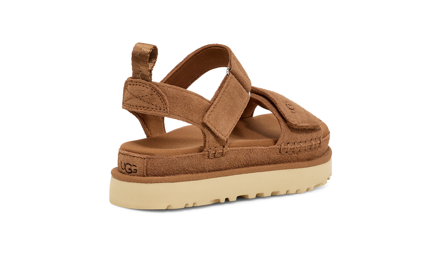 Brown platform sandal with a beige sole and a velcro strap closure.