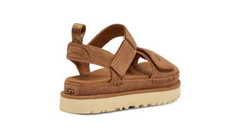 Brown platform sandal with a beige sole and a velcro strap closure.