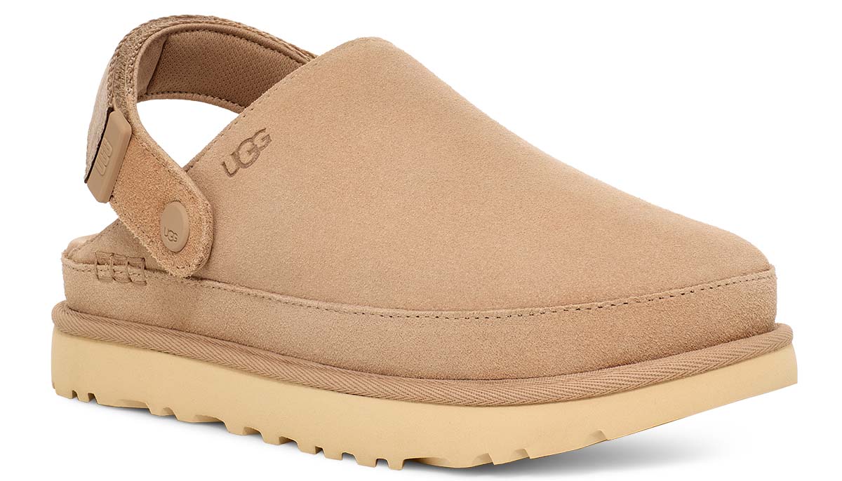 Tan slip-on shoe with adjustable heel strap and visible logo.