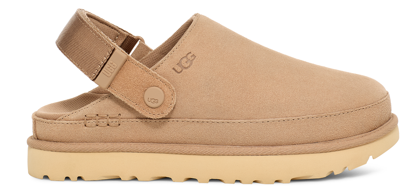 Tan slip-on shoe with heel strap and a thick, light-colored sole.