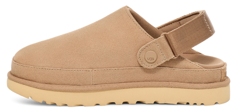 Beige slip-on shoe with a rounded toe, a thick sole, and a back strap.