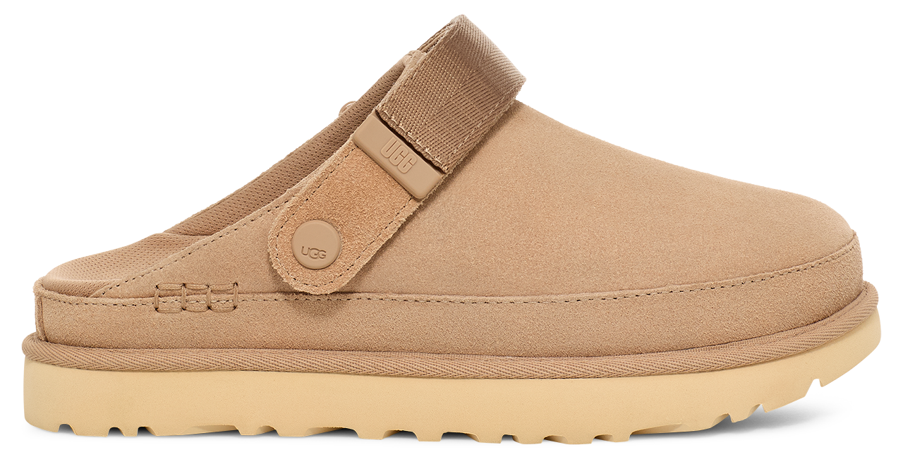 Tan suede clog with adjustable heel strap and thick sole.