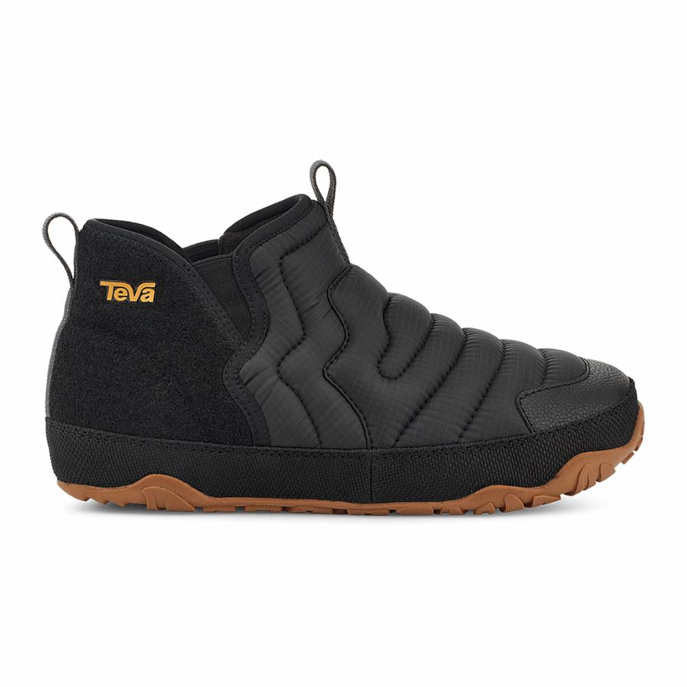Black, puffy, quilted shoe with a tan sole and a logo on the side