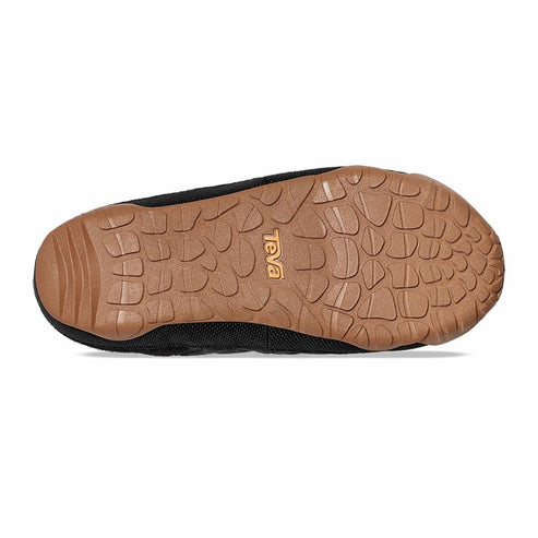 A black slipper with a brown sole showing treads.