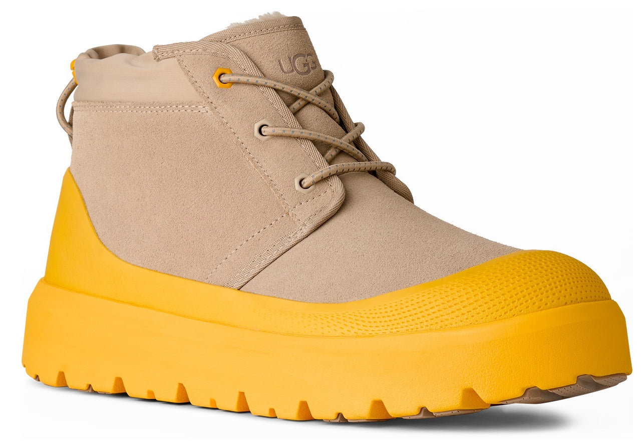 Tan ankle boot with a bright yellow platform sole and lace-up closure.