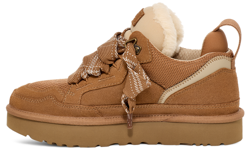 Tan low-rise sneaker featuring suede accents, plush lining, and decorative striped laces.