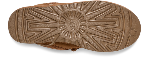 A close-up shot of the shoe sole. It's patterned with radial and zig-zag designs around the brand logo.