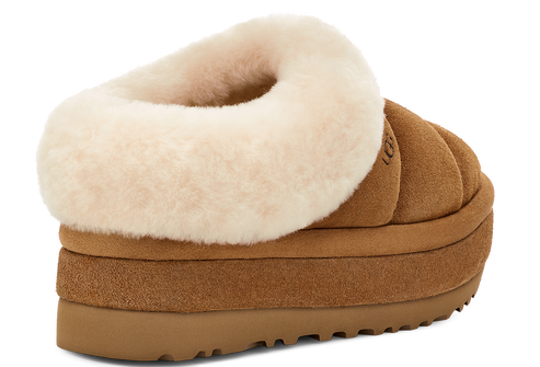 Low-rise platform slipper with suede upper and sheepskin trim.