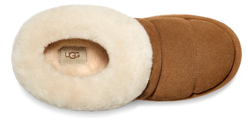 A tan UGG slipper with a cream-colored plush lining.
