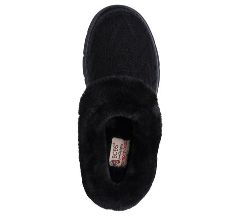 Black slipper with faux fur trim and a visible label inside.