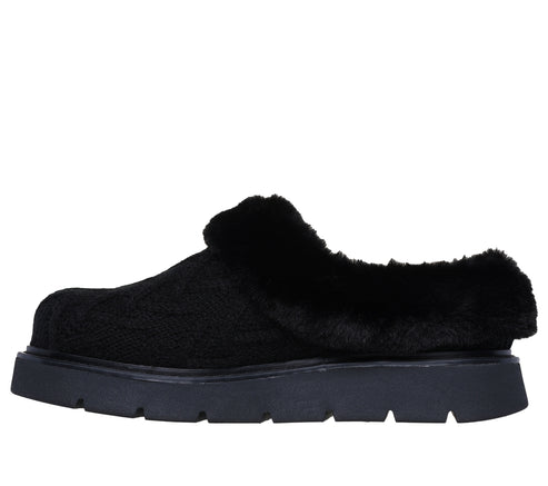 Black faux fur lined clog with a platform sole.