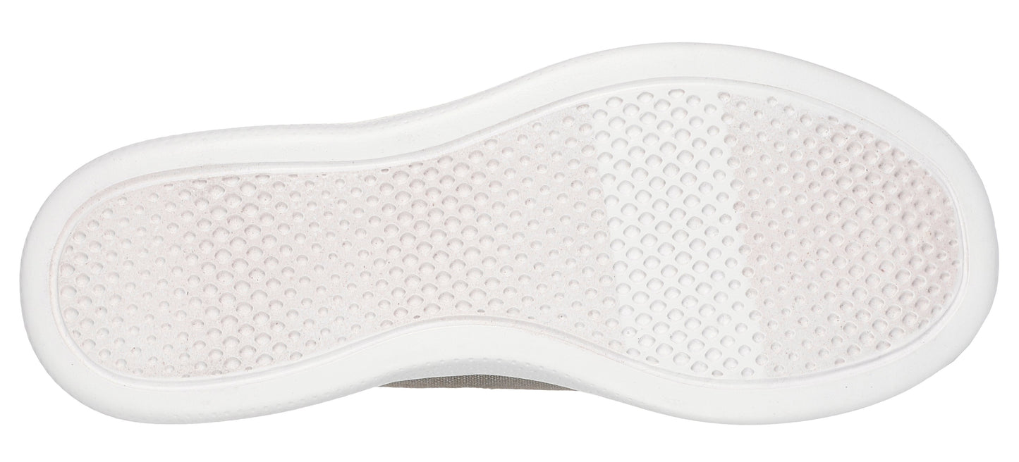 Sole of a shoe with a textured surface surrounded by a smooth border.