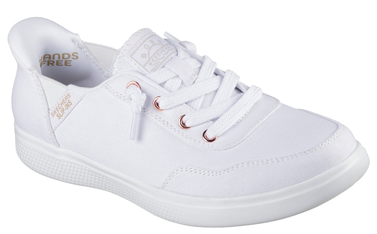 A white casual sneaker with white laces and rose gold eyelets.