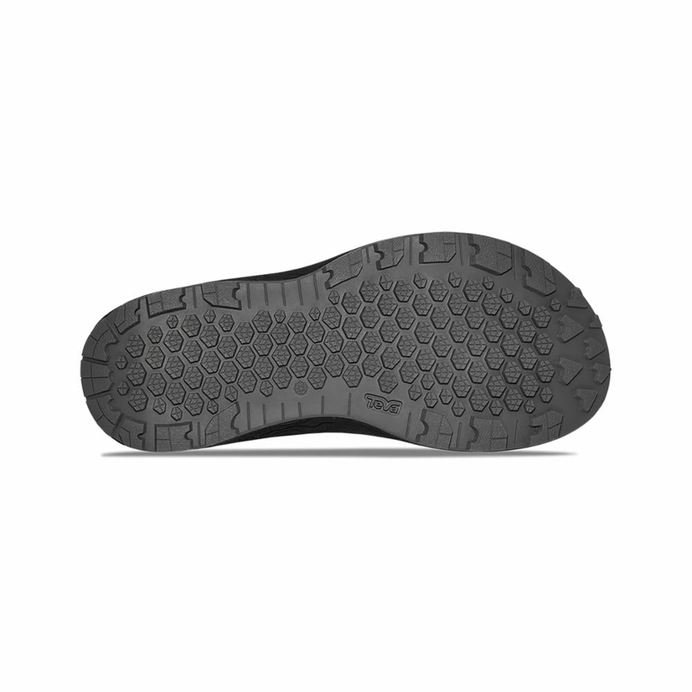 Bottom view of a shoe with dark rubber sole, hexagonal pattern.
