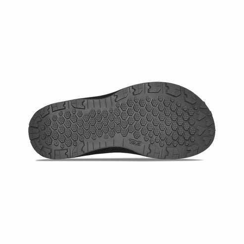 Bottom view of a shoe with dark rubber sole, hexagonal pattern.