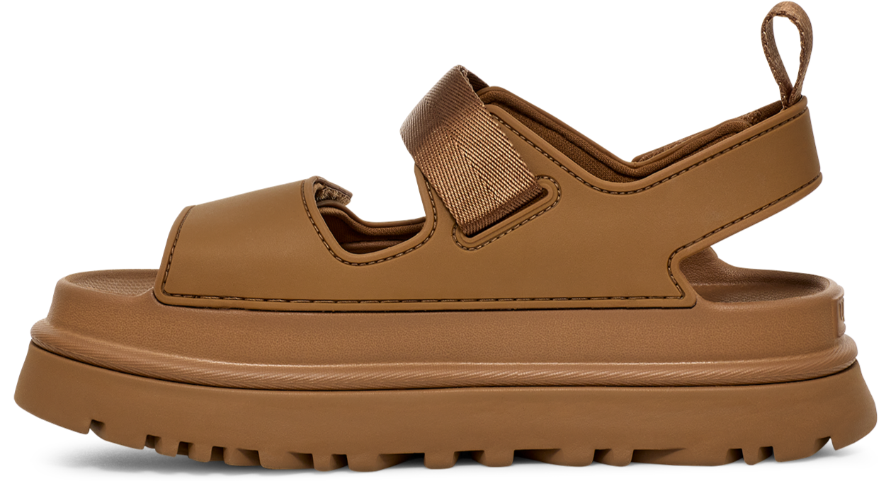 Tan sandal with thick sole and velcro strap.