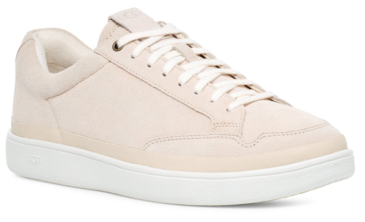 Cream colored leather sneaker with white sole and laces.