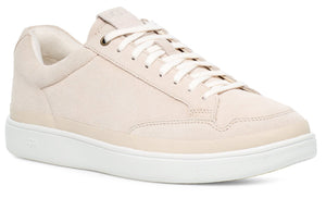 Cream colored leather sneaker with white sole and laces.