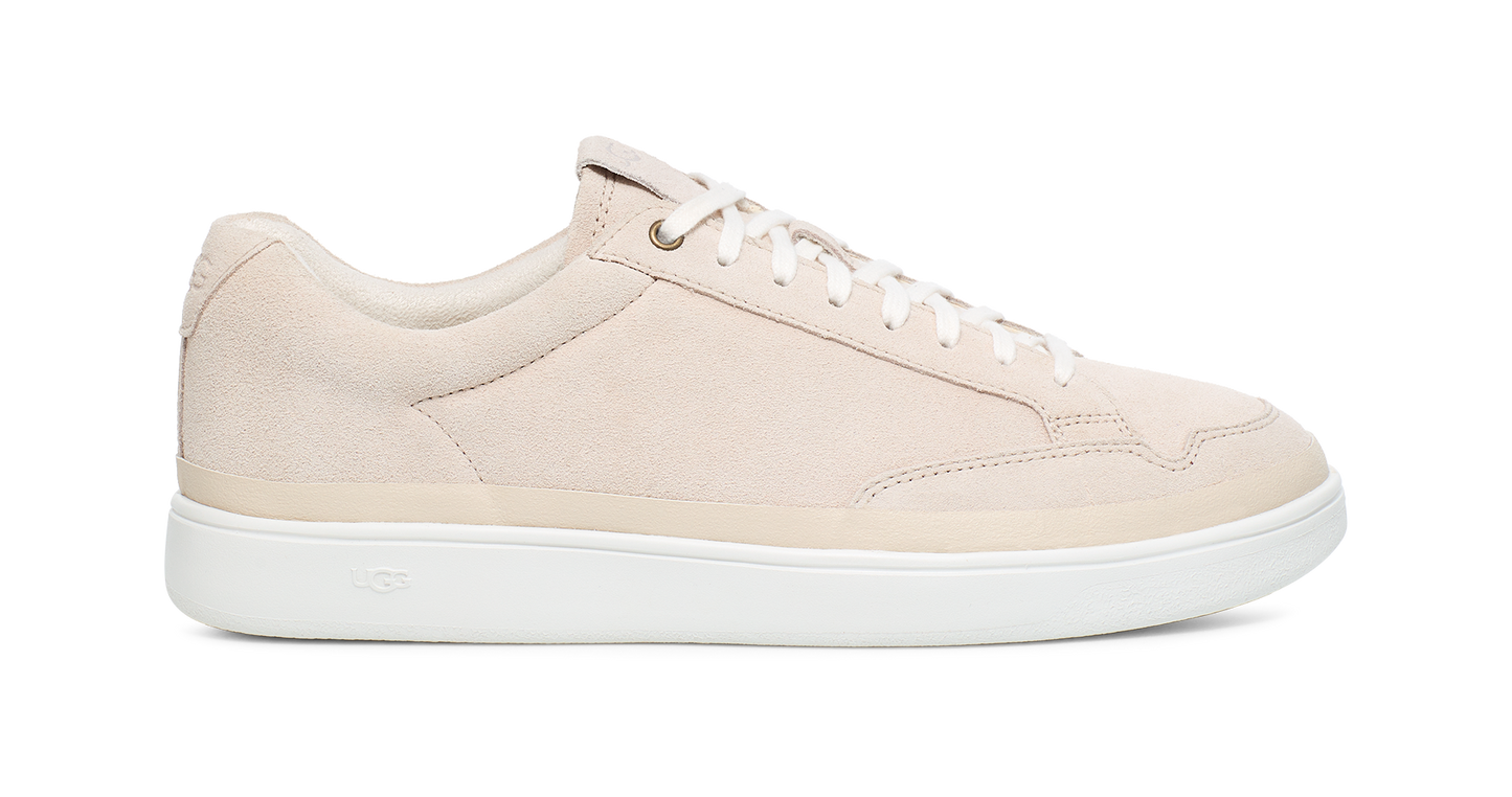 Tan-colored low-top sneaker with a white sole.
