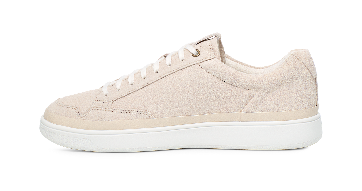 Beige leather sneaker with white laces and white sole.