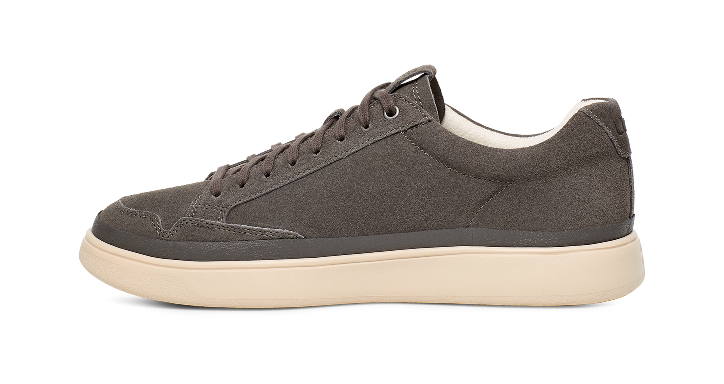 Grey suede sneaker with white sole.