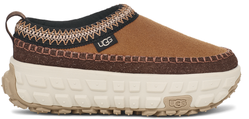 A platform shoe with brown suede top and a light-colored thick treaded sole.