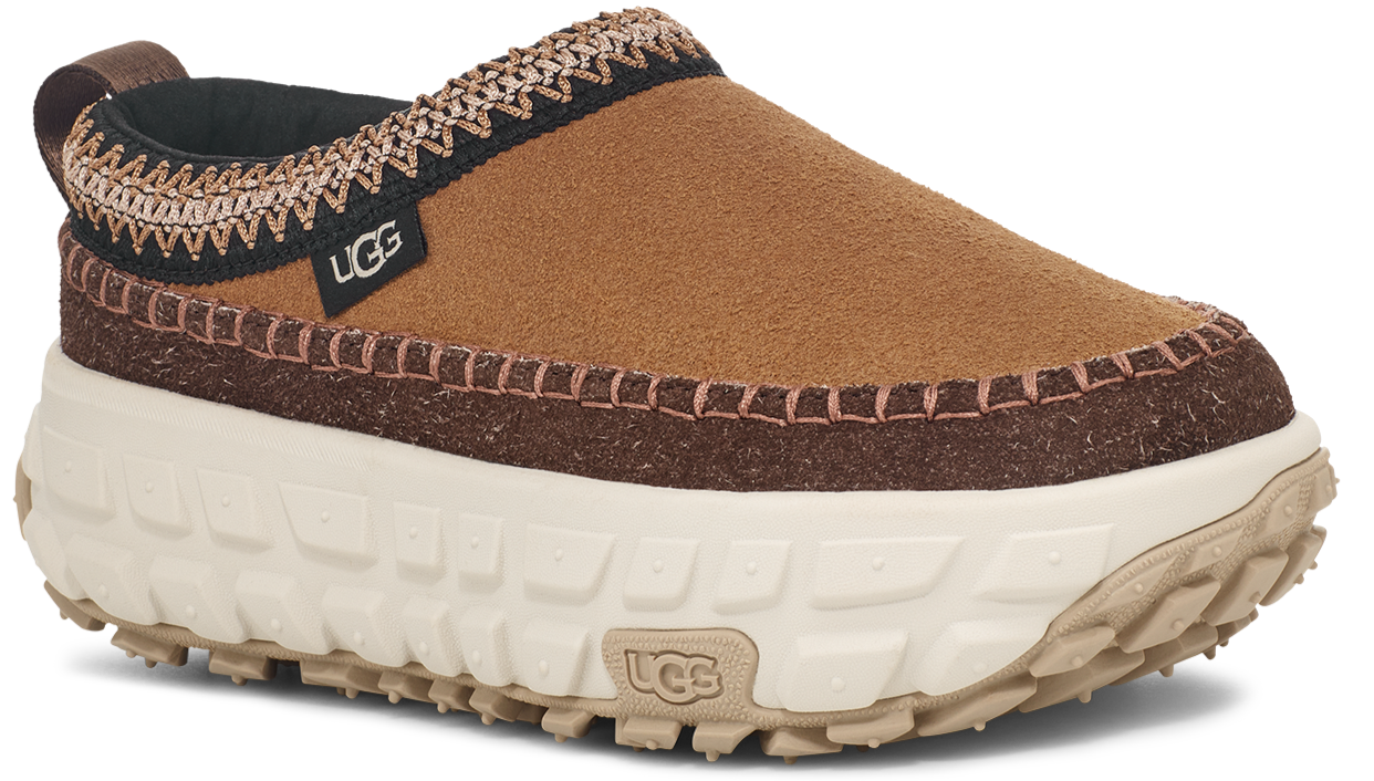 Brown UGG slip-on shoe with thick beige sole and black trim.