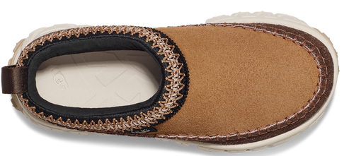 Tan slip-on shoe with a thick cream sole and dark brown trim.