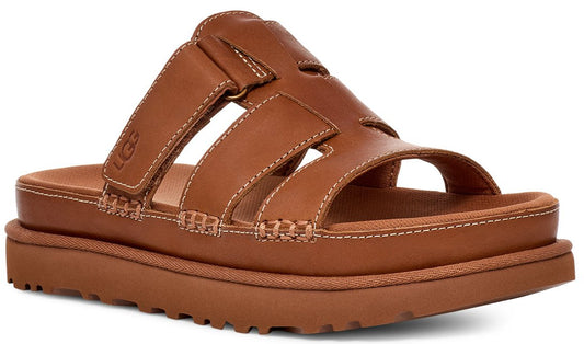 A brown leather sandal with a thick sole and a wide strap across the top of the foot, accented with visible stitching.