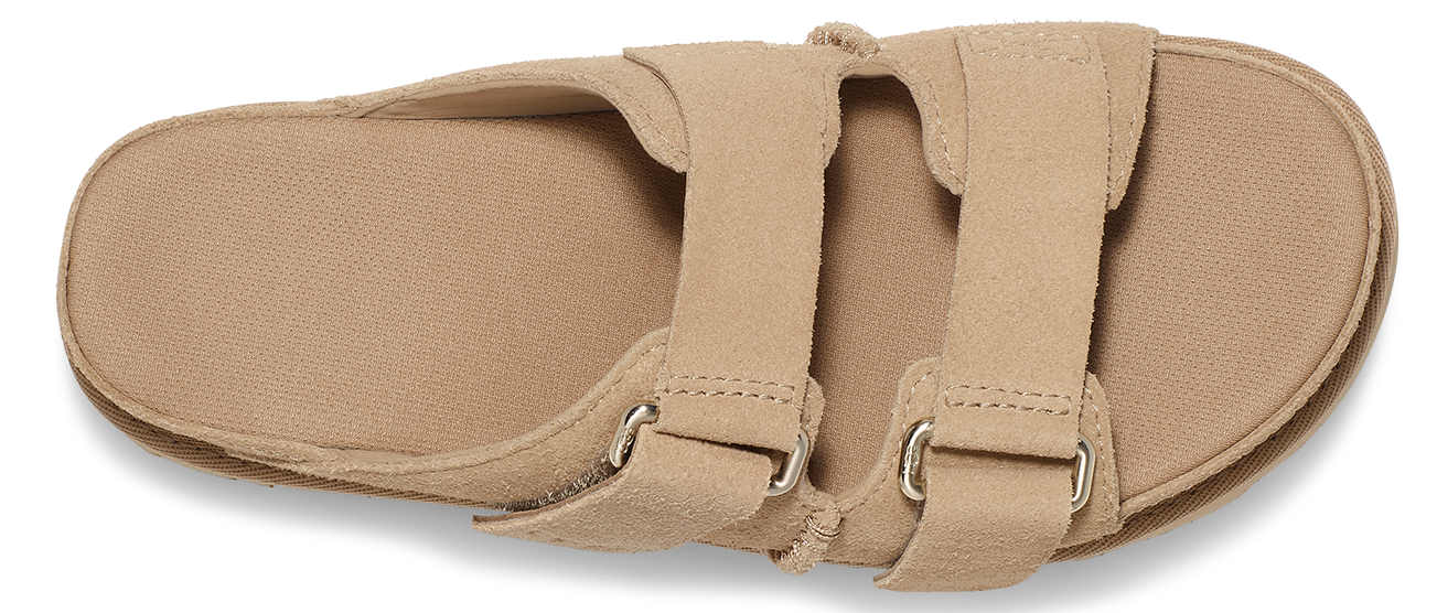 Tan sandal with two straps and metal buckles.