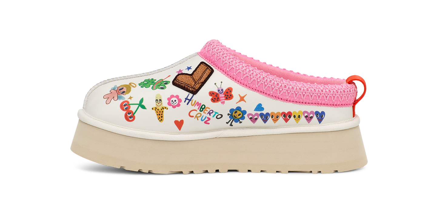 A platform shoe with doodles and a pink knitted collar.