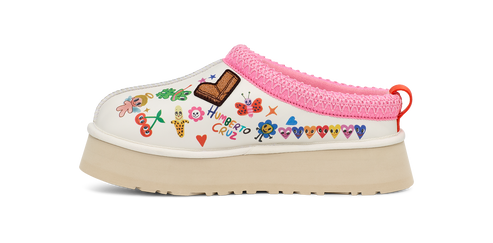A platform shoe with doodles and a pink knitted collar.