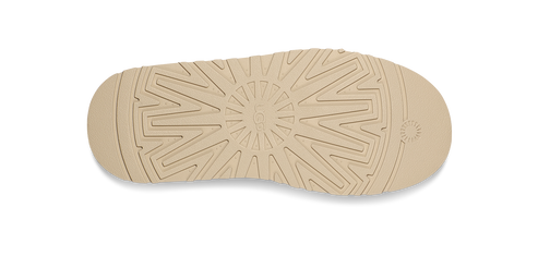 The sole of a shoe featuring a circular traction pattern.