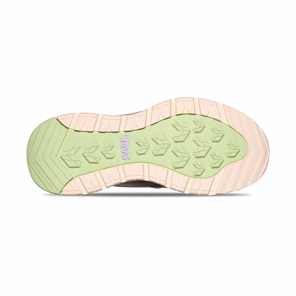 Shoe outsole with arrow-shaped treads and "TEVA" imprint.