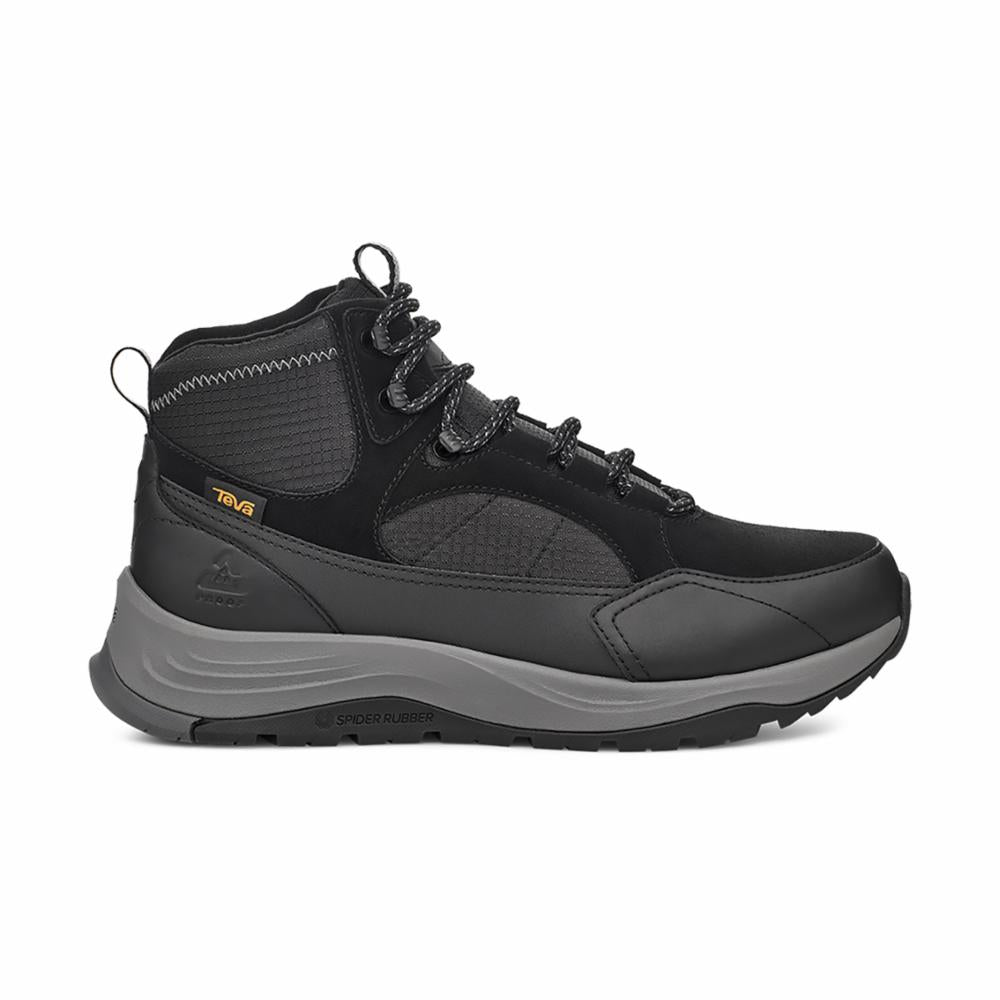 A black, high-top hiking shoe with gray sole and black-and-gray patterned laces. "TEVA" is visible on the side.