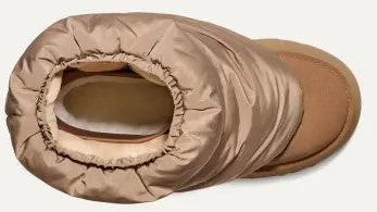 Tan slipper boot with a puffy shaft and exposed sole.