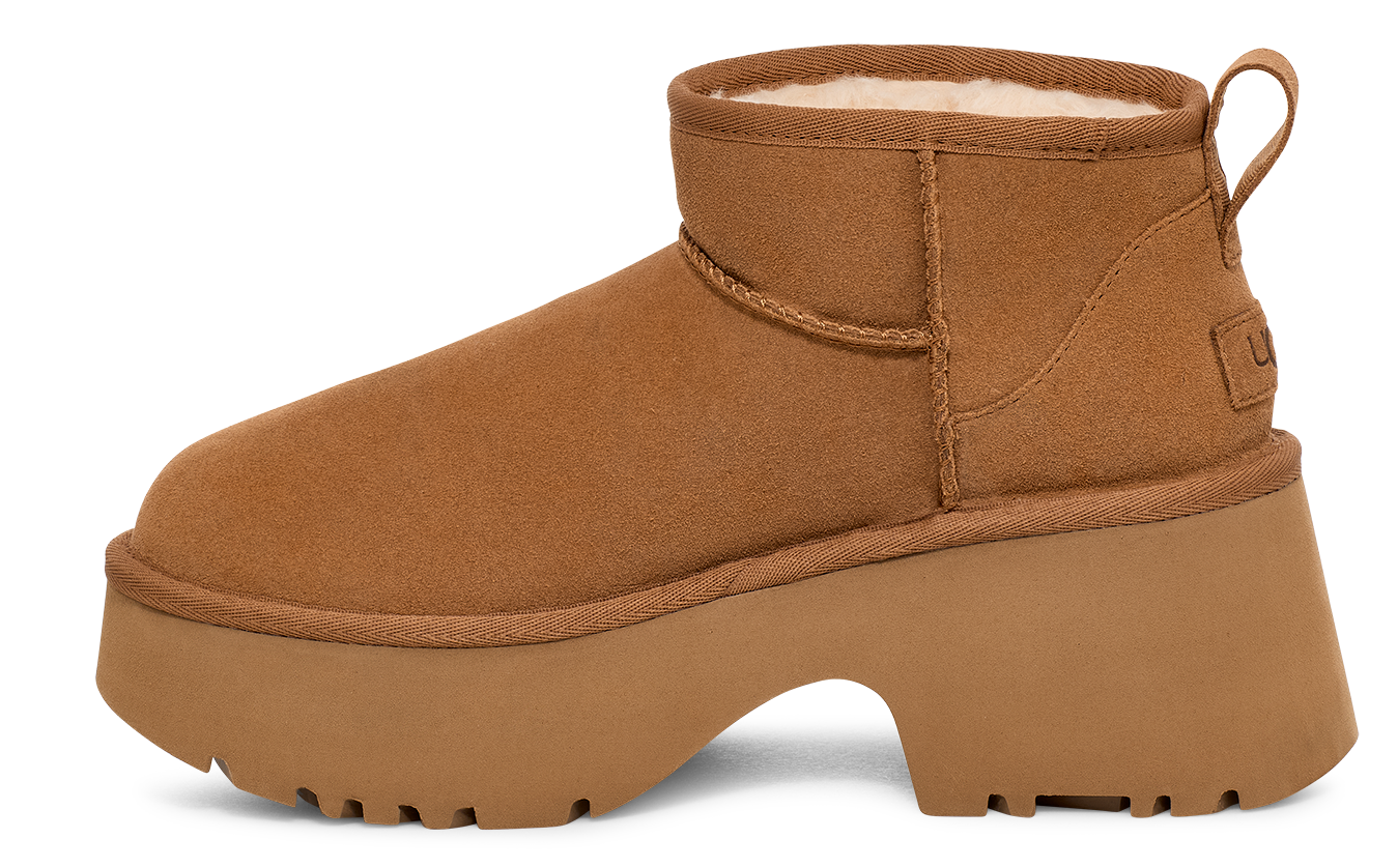 Tan ankle boot with chunky platform sole and sheepskin lining.