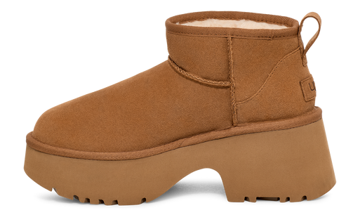 Tan ankle boot with chunky platform sole and sheepskin lining.